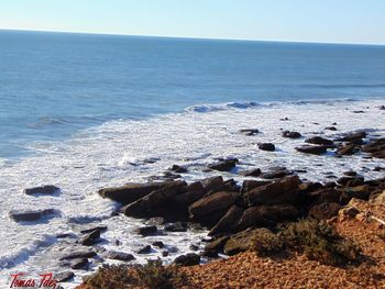 Scenic view of sea against clear sky