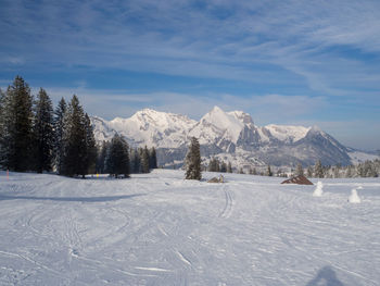 Scenic view of snowcapped mountains against sky