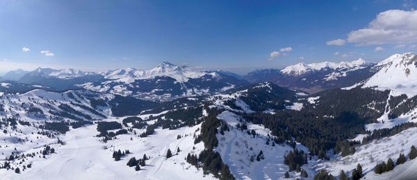 Scenic view of snowcapped mountains against sky