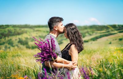 Couple in wildflower meadow