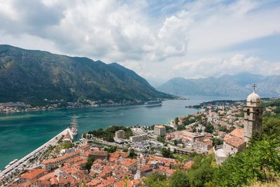 High angle view of buildings by sea against sky at kotor