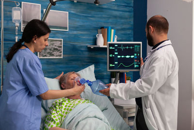 Doctor examining patient in hospital