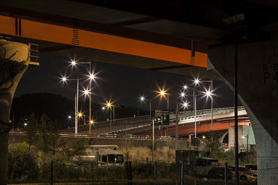 Low angle view of illuminated street light at night