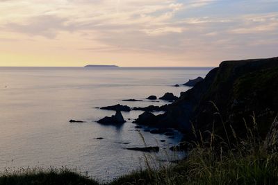 Scenic view of sea against sky during sunset