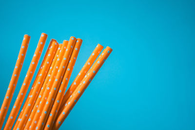 Close-up of orange blue sky over white background