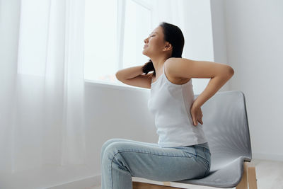 Young woman exercising at home