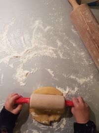 High angle view of hand holding ice cream cone