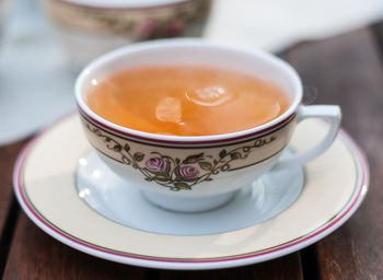 Close-up of coffee cup on table