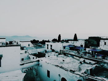 High angle view of buildings against sky during winter