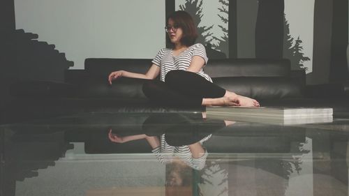 Full length of woman standing in park