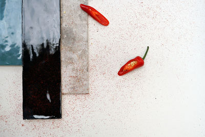 High angle view of red chili peppers on table