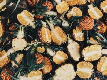 High angle view of halved pineapples