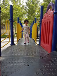 Full length of woman standing on playground