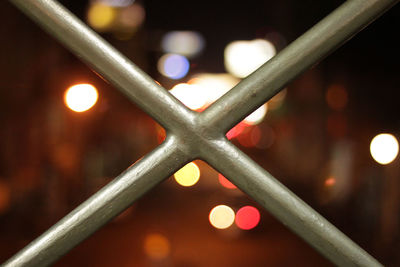 Close-up of illuminated chainlink fence