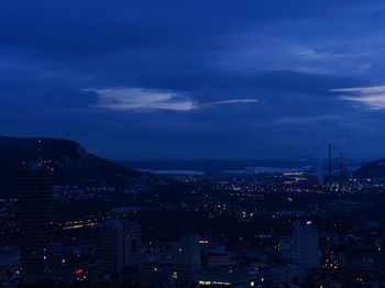 High angle view of illuminated buildings in city at night