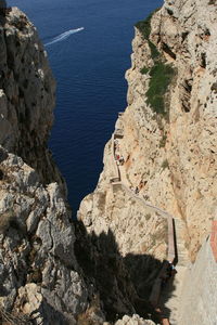 High angle view of rocks on sea shore