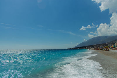 Scenic view of sea against blue sky