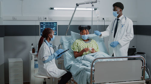 Doctor examining patient in hospital