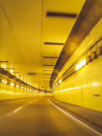 Interior of illuminated yellow tunnel