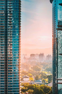 Buildings in city with beautiful sunrise 