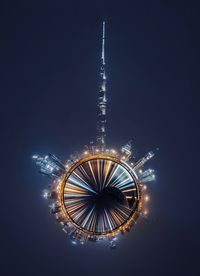 Illuminated ferris wheel at night dubai