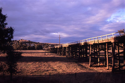 Prince alfred bridge over field against cloudy sky