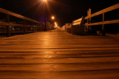 Illuminated bridge at night