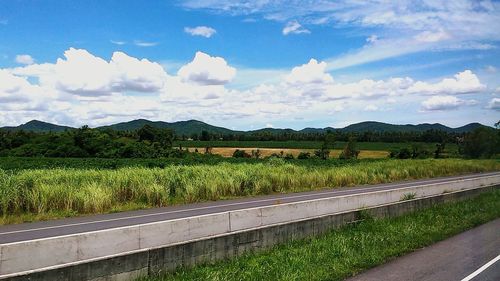 Scenic view of landscape against cloudy sky