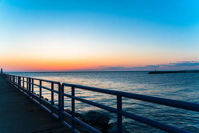 Scenic view of sea against clear sky during sunset