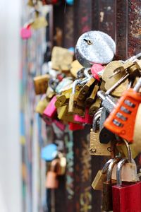 Close-up of padlocks hanging on metal