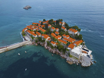 Aerial view of buildings on island in sea