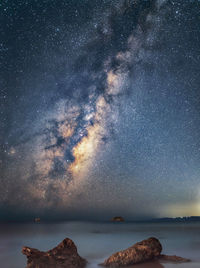 Scenic view of sea against sky at night