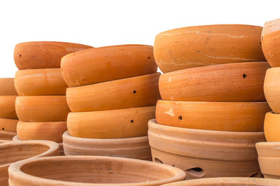 Close-up of stack of firewood against white background