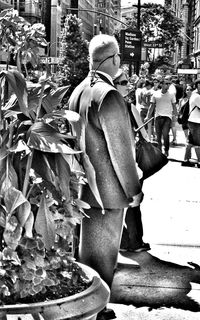 Man looking at city street