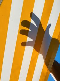 Full frame shot of yellow sign on wall