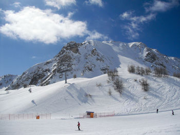 Scenic view of snowcapped mountains against sky