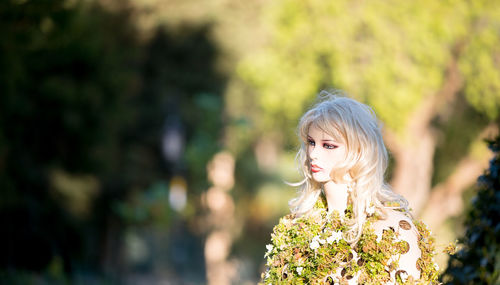 Portrait of woman holding flower