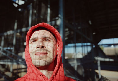 Portrait of man wearing red hat