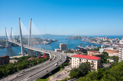 High angle view of bridge over sea against blue sky