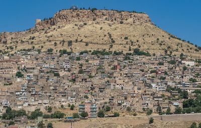 Aerial view of residential buildings against sky