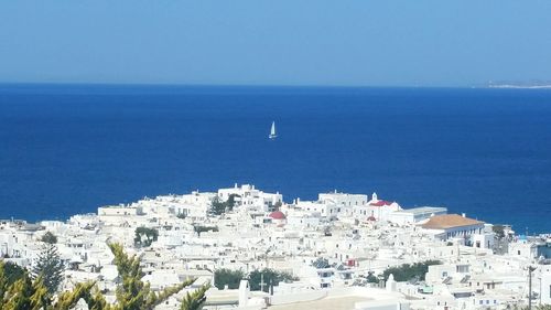 High angle view of sea against clear blue sky