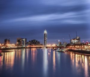 Illuminated city at waterfront
