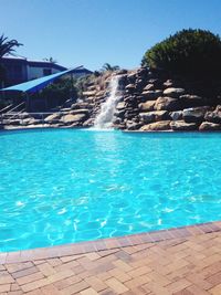 Scenic view of swimming pool against clear blue sky