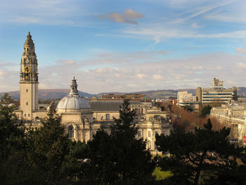 Buildings in city against sky