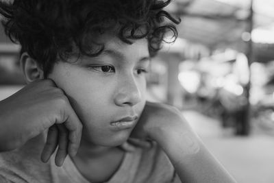 Close-up of boy looking away