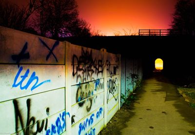 Graffiti on wall at sunset