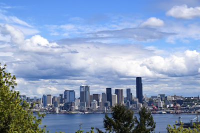 Cityscape against cloudy sky