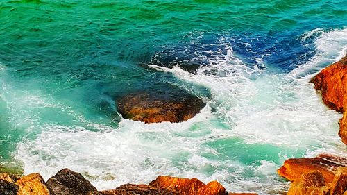Waves splashing on rocks