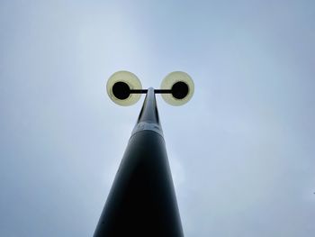 Low angle view of communications tower against sky