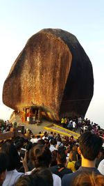 People standing against clear sky